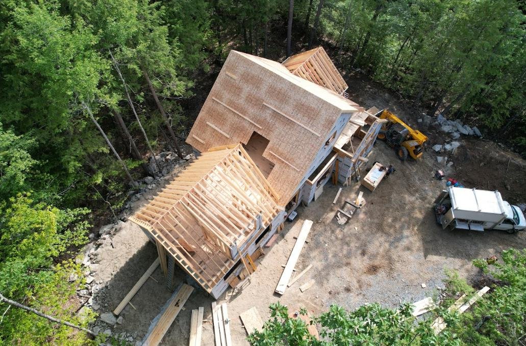The image shows a house being constructed