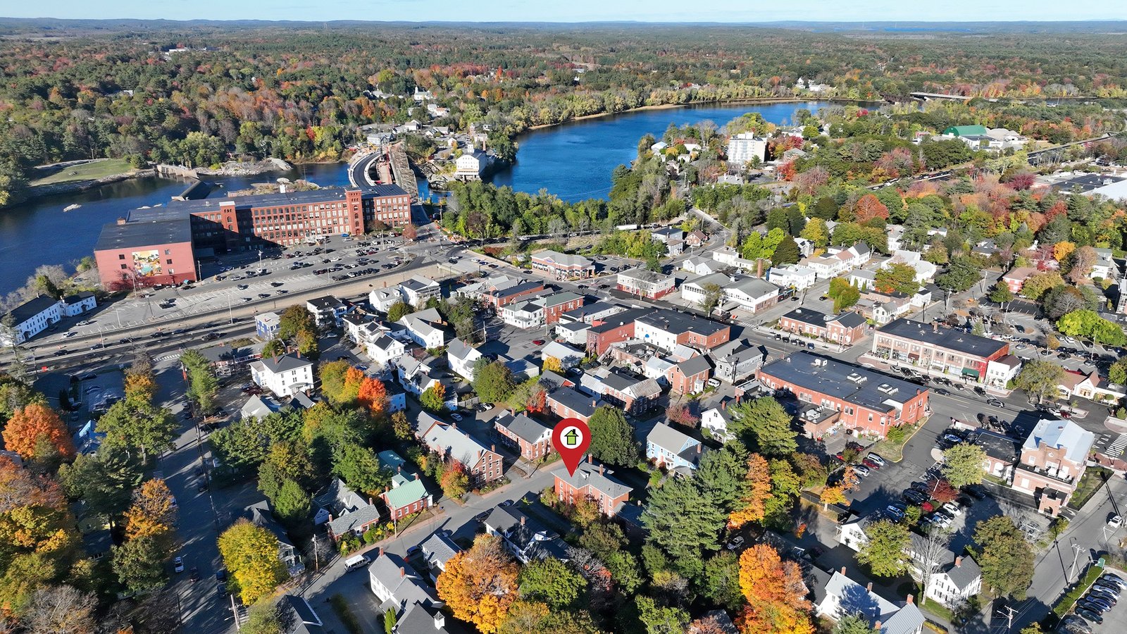 Aerial view of a multi-unit rental property with road access in Brunswick Maine