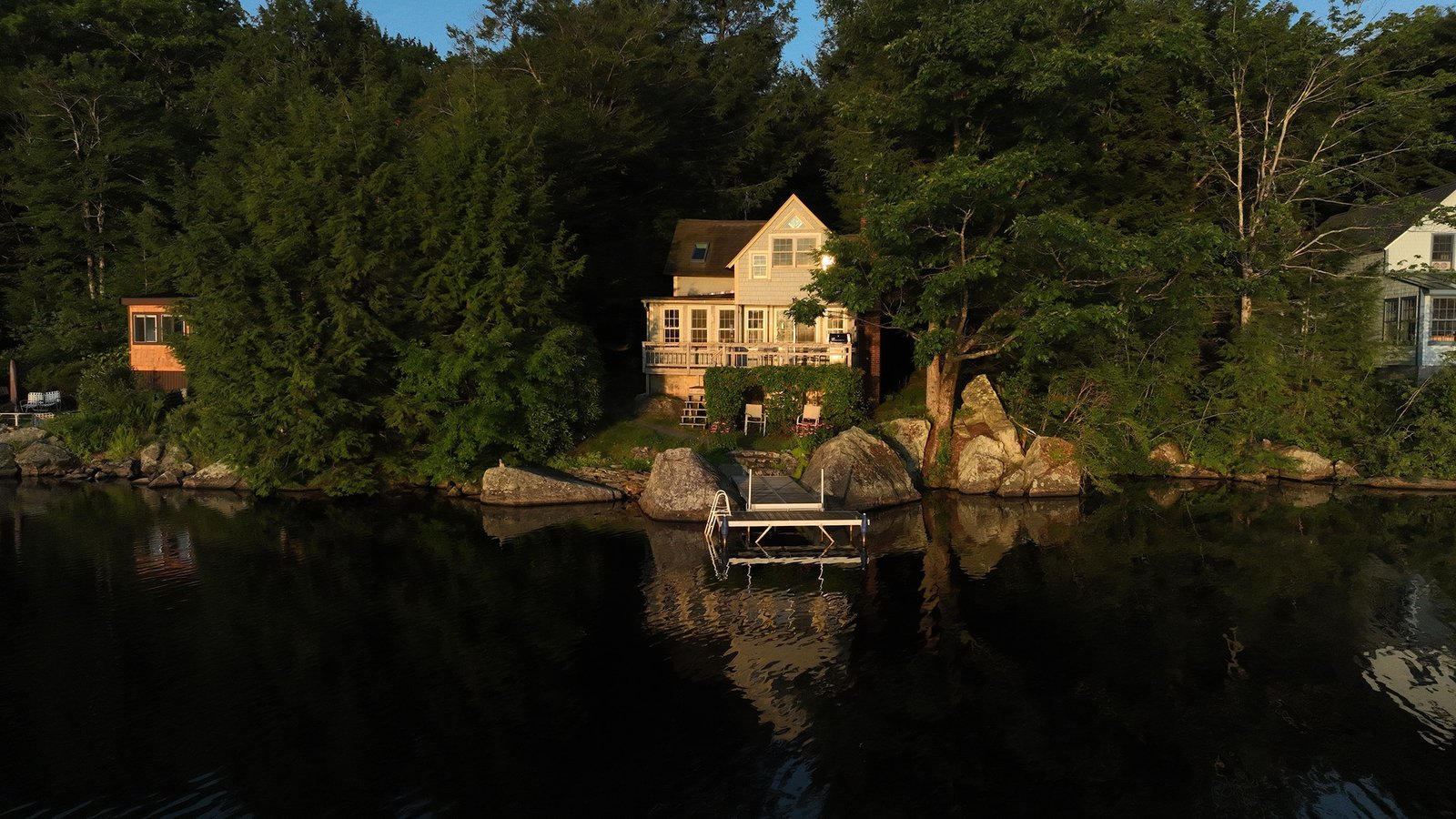 Aerial view of a lakefront property at sunrise in Harrisville New Hampshire