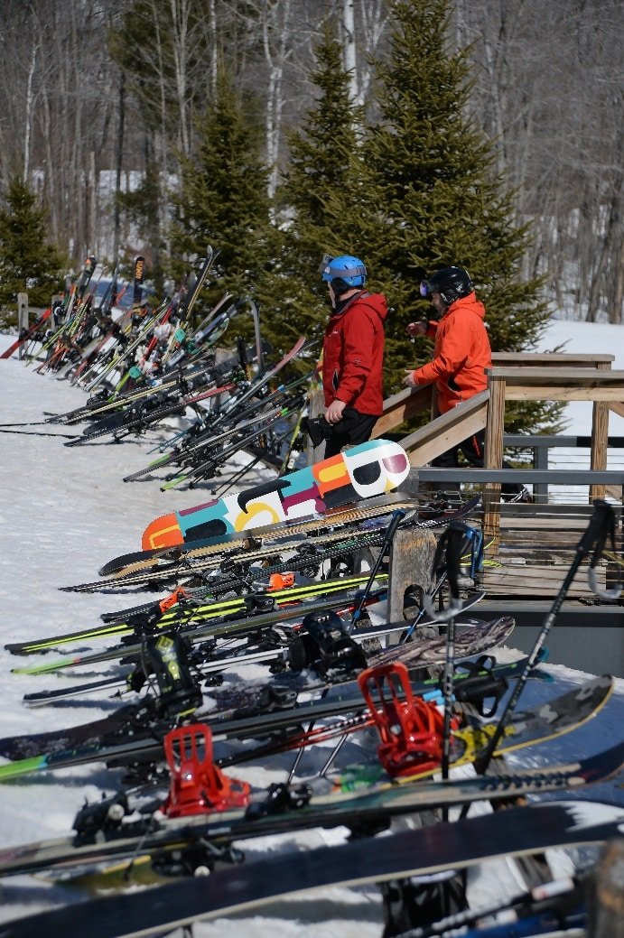 Aerial drone photograph of a group gathered at an outdoor chairlift event