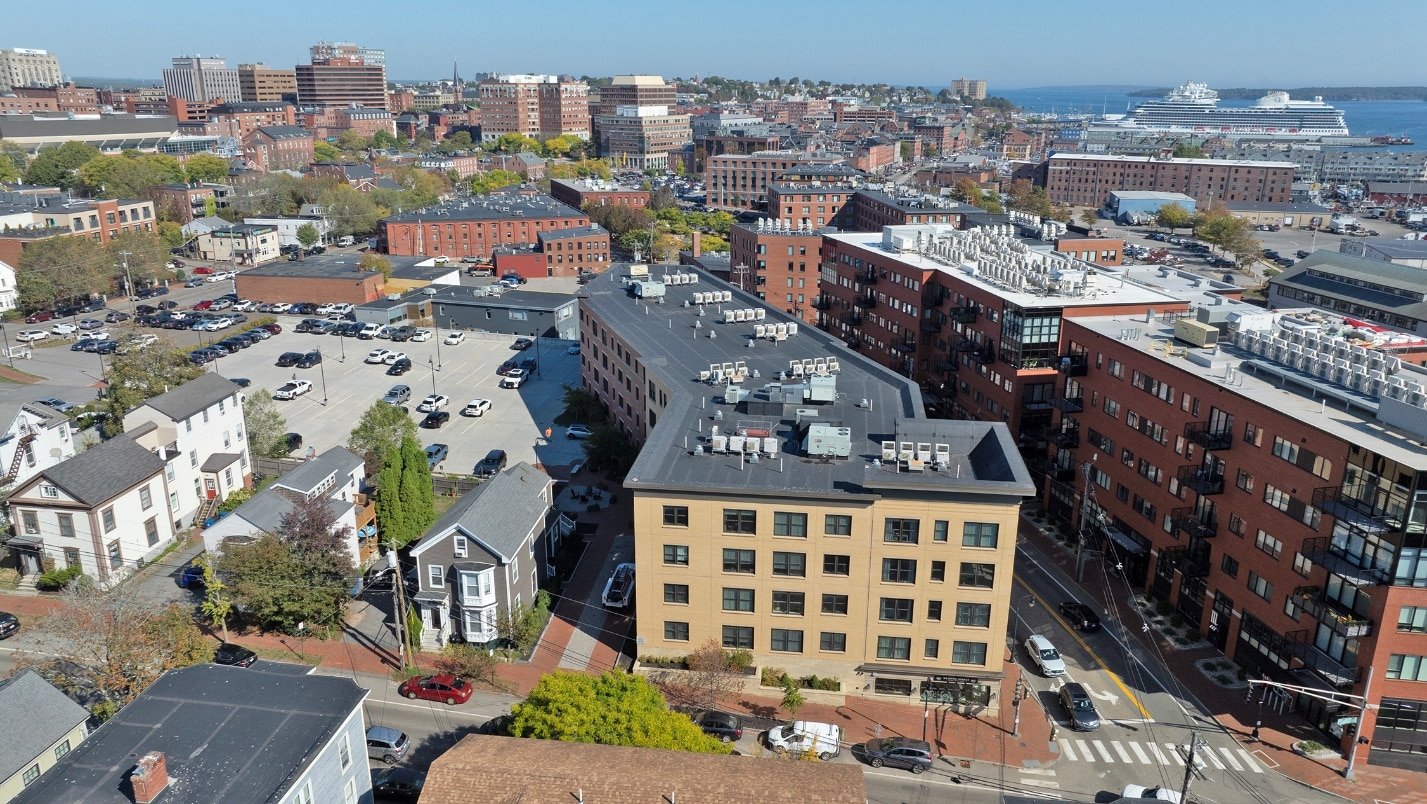 Aerial drone photograph of a multi-story commercial building
