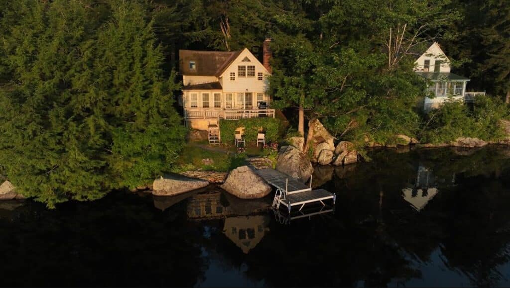 Aerial drone photograph of a residential property with a paved driveway